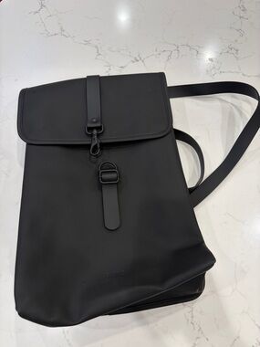 Rains Black Roll-Top Backpack with Strap Closure